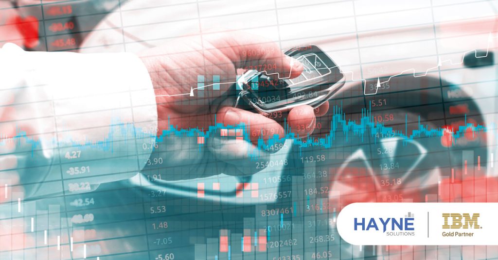 Main: Data and planning analytics overlaying a person holding a car key. Inset: HAYNE Solutions and IBM Gold Partner logos.