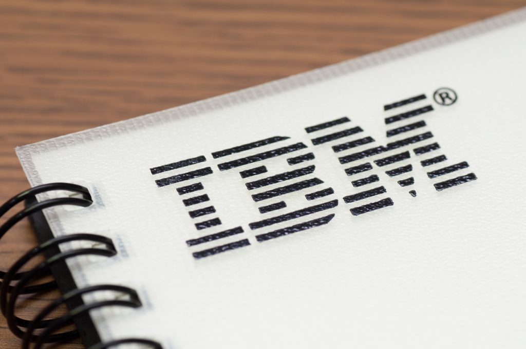 Black IBM logo on a white notepad.