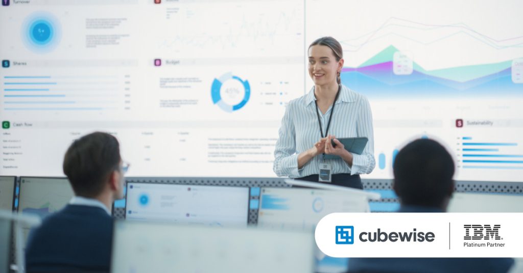 Main: An employee gives a data and planning analytics presentation. Inset: Cubewise and Planning Analytics logos.