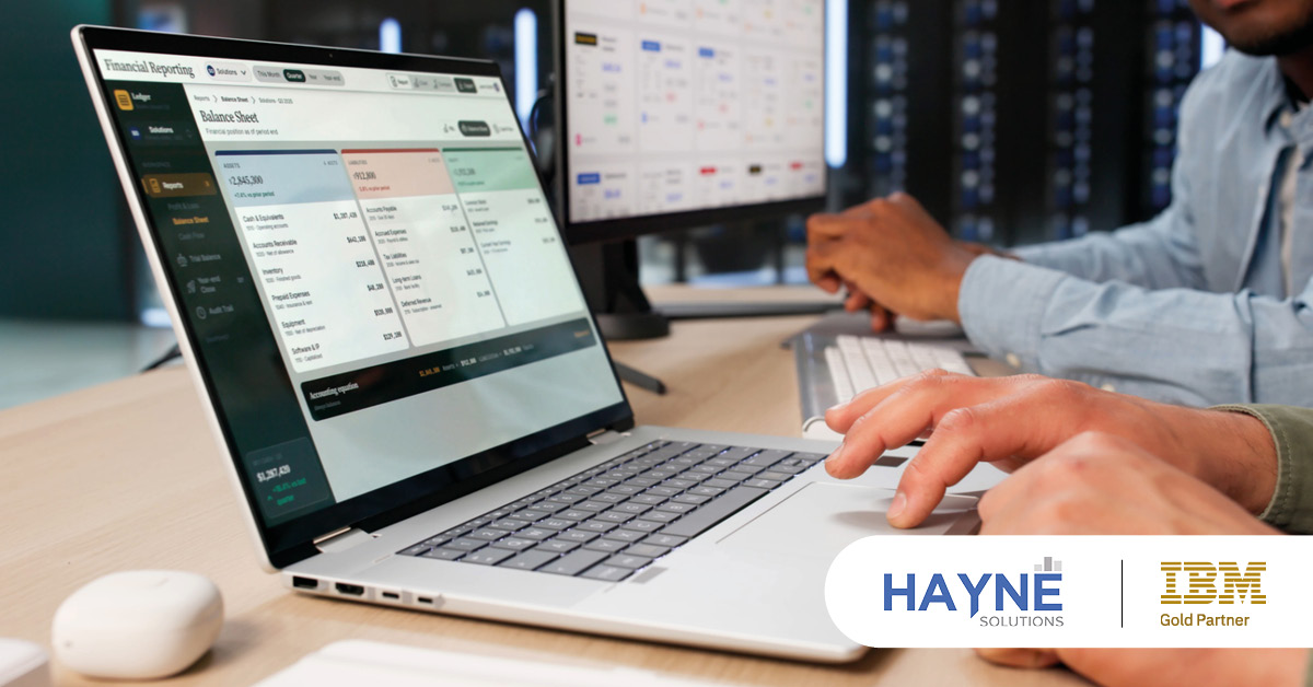 Colleagues analyse a reporting dashboard showing financial figures
