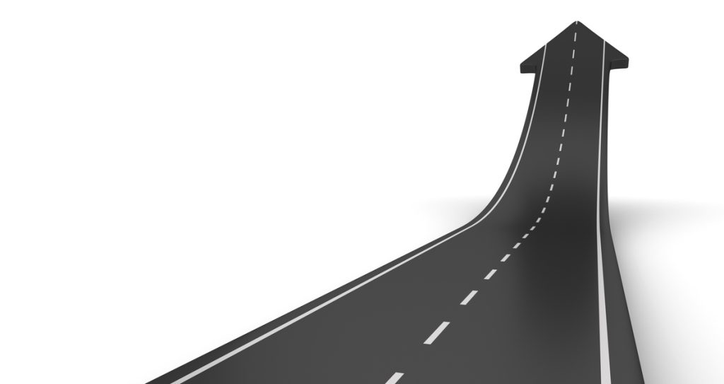 An arrow road travelling and pointing upwards.